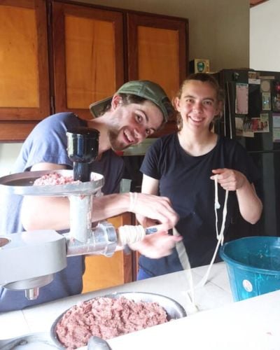 Elizabeth and fellow West Africa intern, Luke, learn how to make sausage from scratch. 