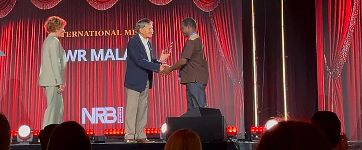 Receiving an award on a stage