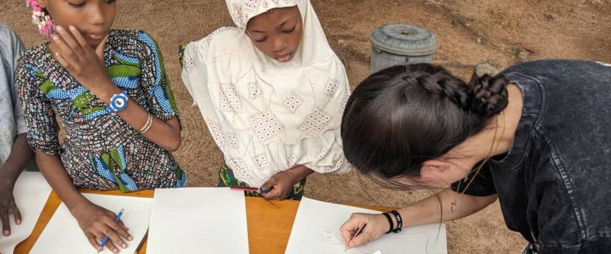 Grace spends time with local children where she serves with TWR in West Africa.