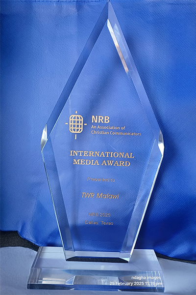 A transparent trophy award on a blue background