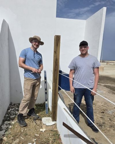 Bryson Browning (right) and fellow intern, Burke Murray (left), used part of their summer to build fencing on the Bonaire site