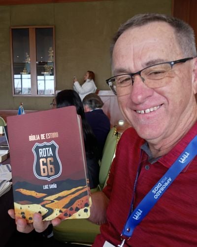 Jon Fugler holds the Route 66 Study Bible with Luiz Sayão during the Ibero-Latin America Partners Conference. 