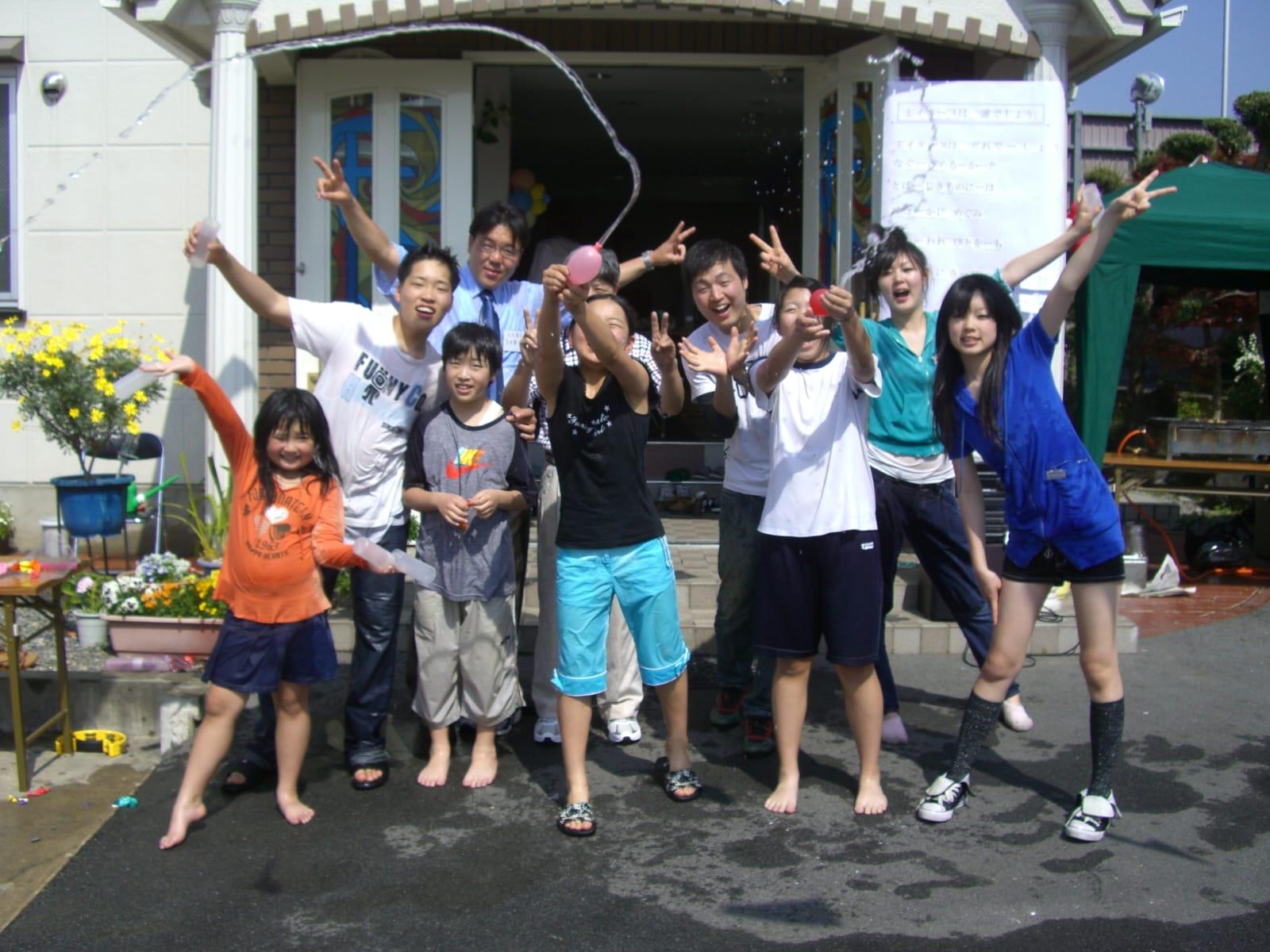 Pastor Park and a group of children pose in front of a church