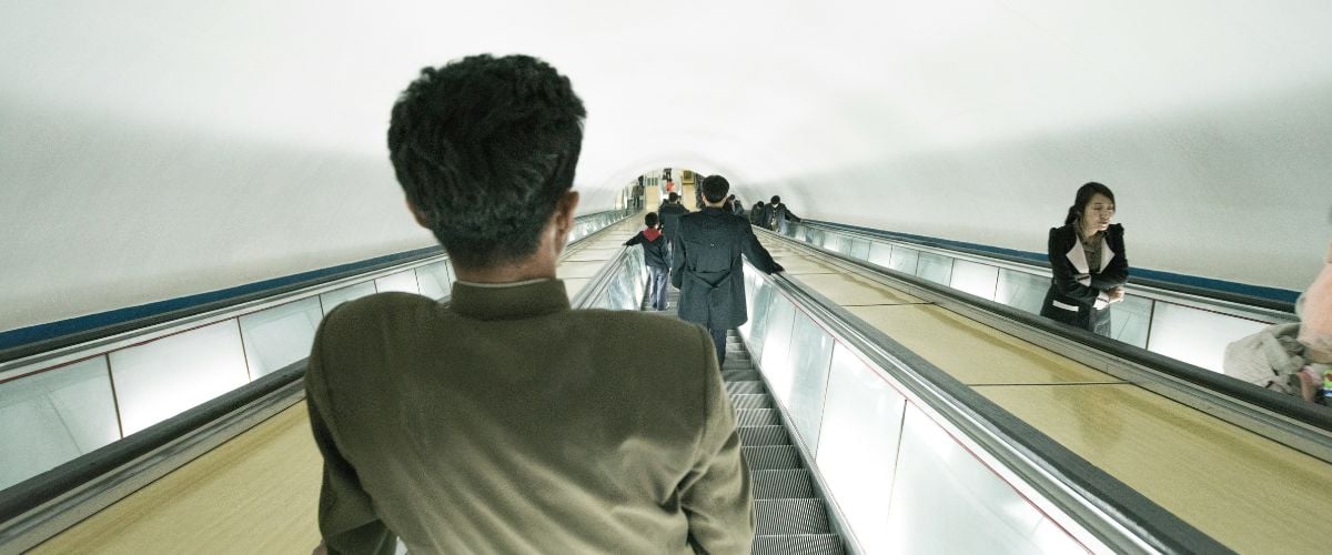 Peple in North Korea ride escalators to and from the underground.