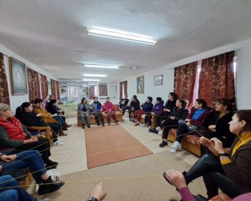 A Women of Hope group prays for the TWR Albania team