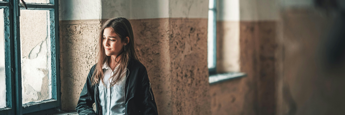 Woman looking out of a window