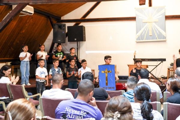 A group of 10 kids acting out the moves for one of the songs