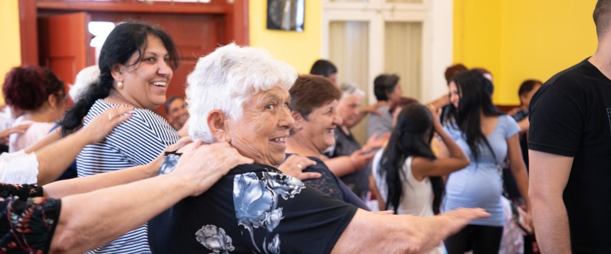 Roma women participate in a movement exercise in a church in Bulgaria.