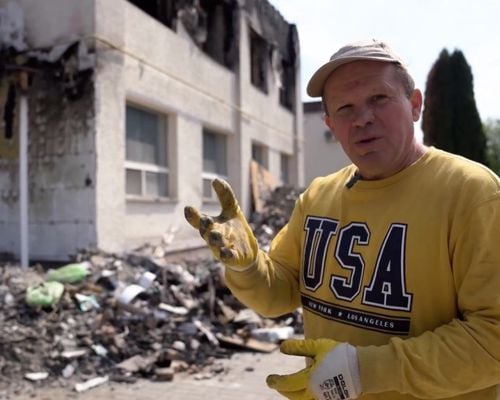 TWR Ukraine Director, Alexander Chmut, assists in cleanup of Irpin Theological Seminary in May of 2022. The school sustained damages in the early days of the war in Ukraine.