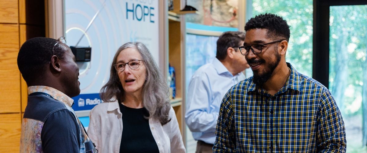 Jehiel Ortiz (right) catches up with TWR International Director of Eastern and Southern Africa, Victor Kaonga, and TWR Director of US Hispanic Ministry, Elisa Keefe
