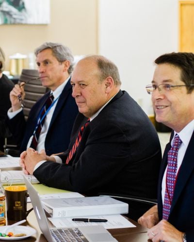 Former TWR President Lauren Libby sits between TWR Chairman of the Board Jeff Jones (left) and TWR Interim President Cassius Smith (right)