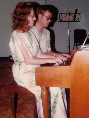David and Flora Rittenhouse play piano together during their early years.