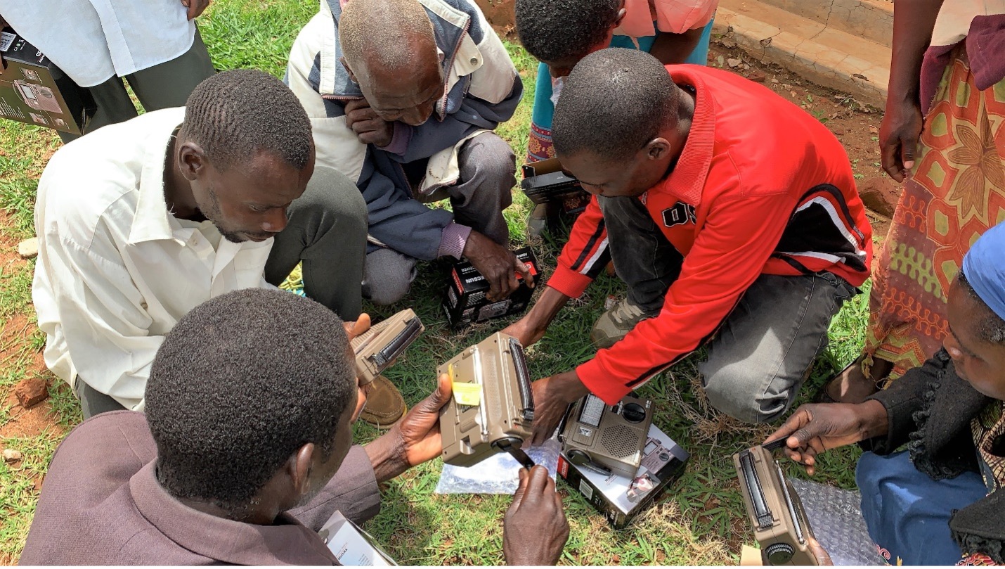 A group of men gather with radios in the African nation of Malawi in this 2019 photo. Globally, radio remains the most widely consumed medium, according to UNESCO. TWR, also known as Trans World Radio, uses radio to reach more than 190 countries. Photo by TWR missionary Kelly Gilbert. 