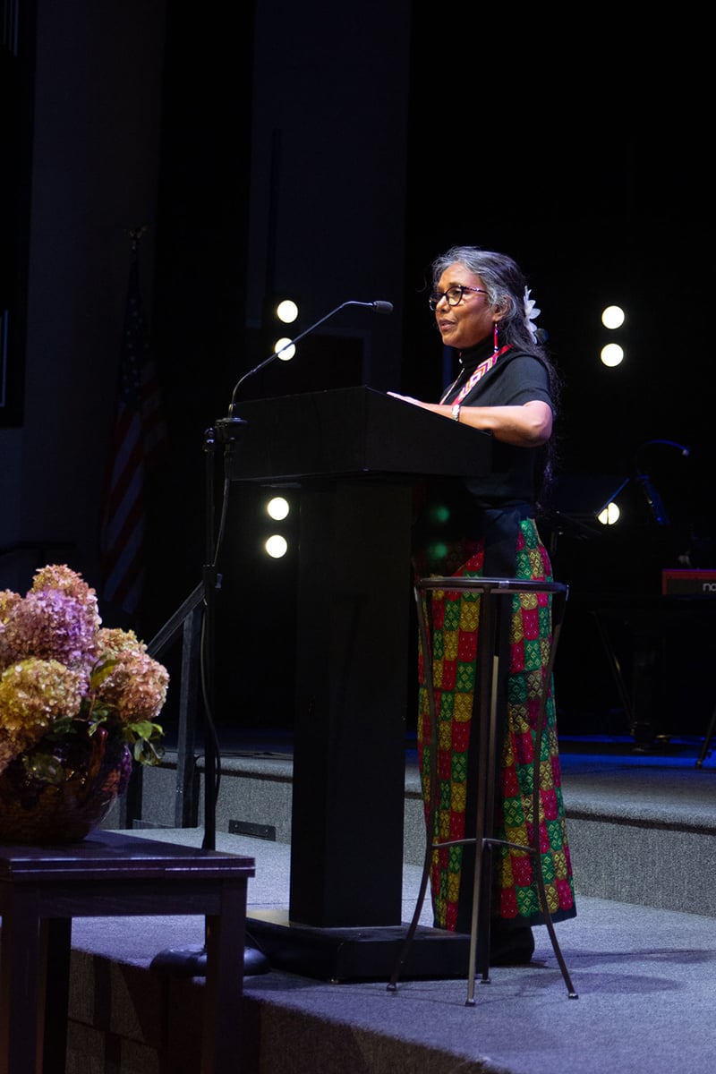 Board member Sona Minz reads Scripture